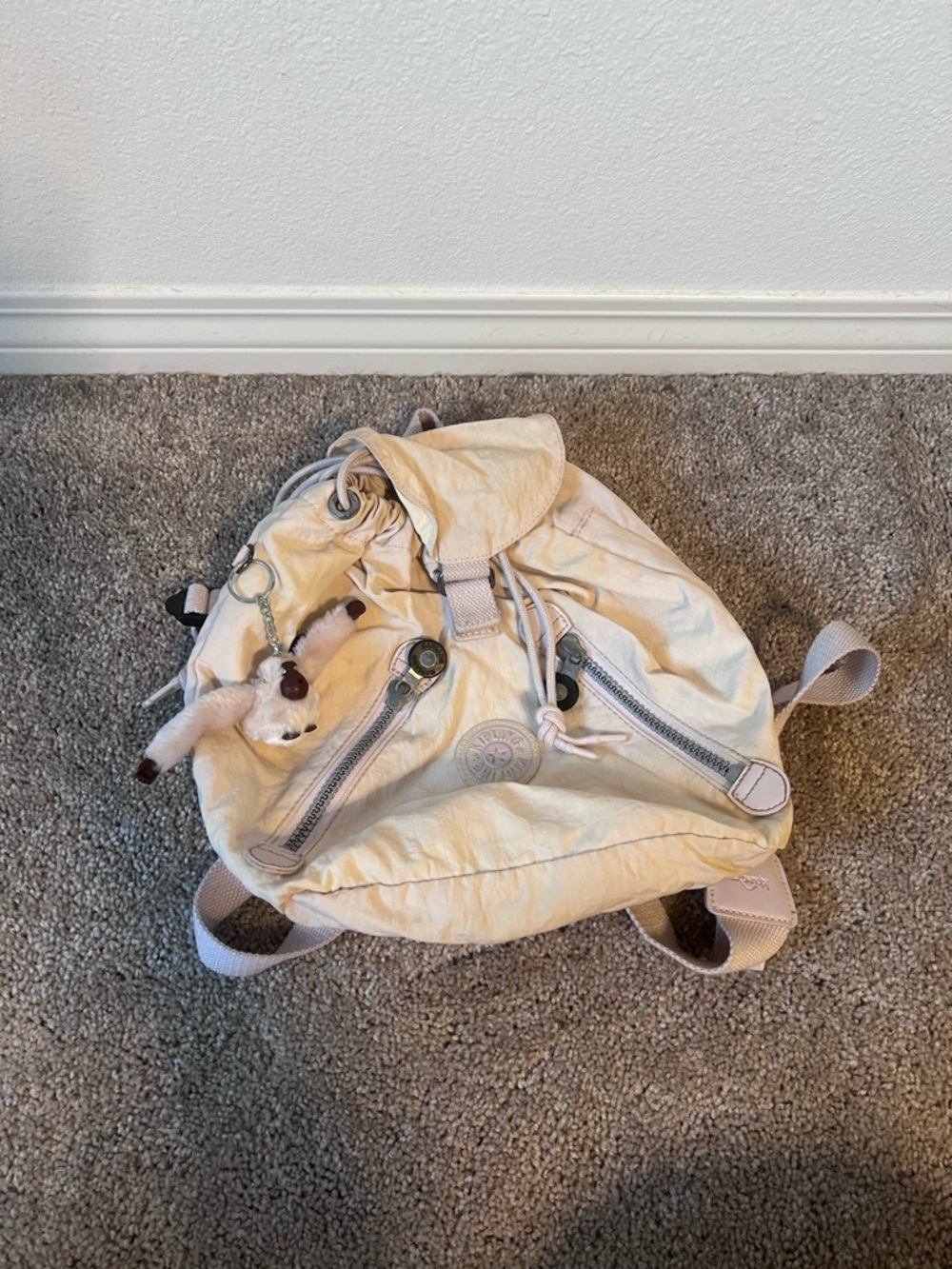 Kipling Cream Drawstring Backpack with Monkey Keychain